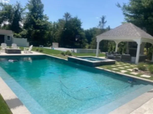 Backyard pool and hot tub after cleaning, water clear and blue