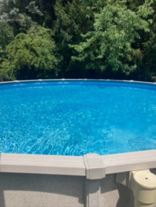 Round above-ground pool with sparkling clean water